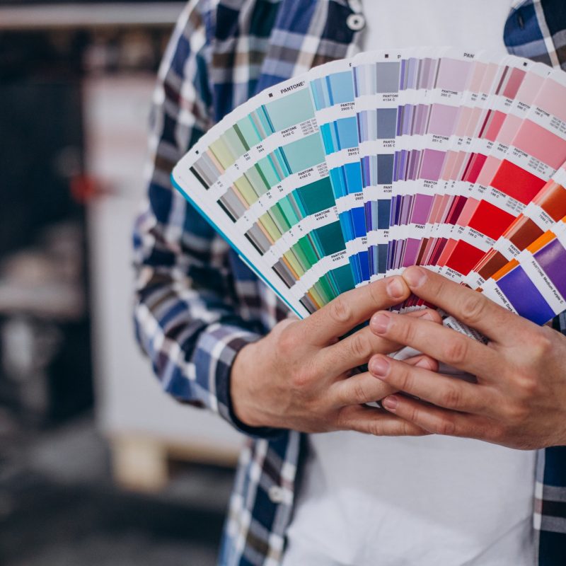 man-working-printing-house-with-paper-paints